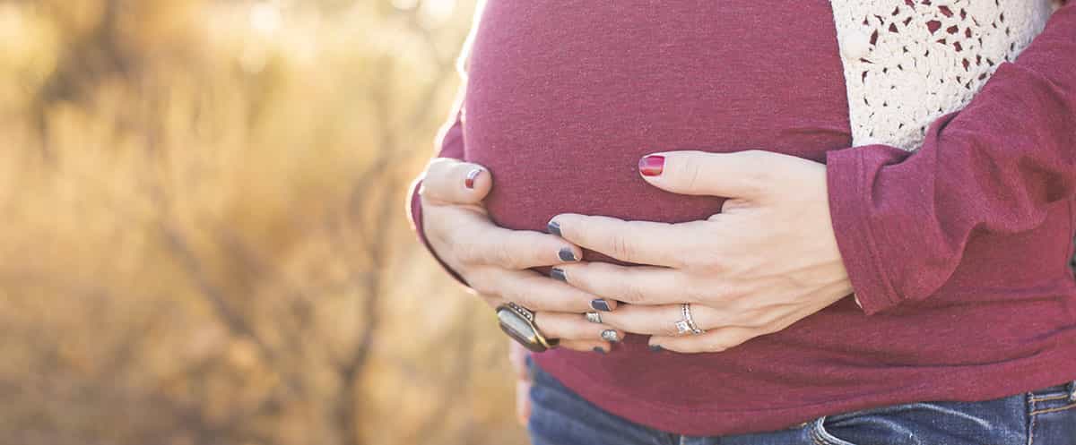 Woman holding stomach