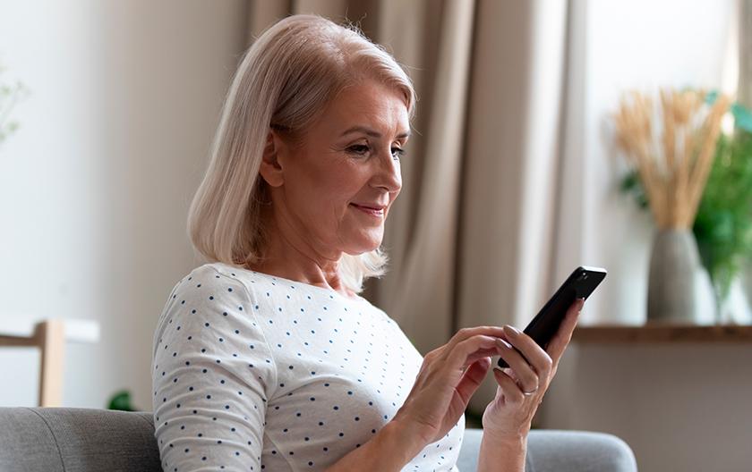 Woman using a continuous glucose monitor (CGM)