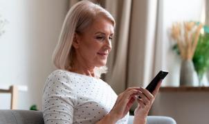 Woman using a continuous glucose monitor (CGM)