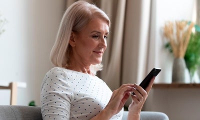 Woman using a continuous glucose monitor (CGM)